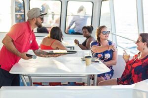 Sunset Sail Tour with Local Food - Pelican Rock, Lovers Beach, Neptune’s Finger, and the Arch: seeing Cabo fast