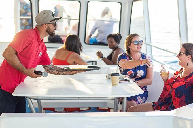 Sunset Sail Tour with Local Food - Pelican Rock, Lovers Beach, Neptune’s Finger, and the Arch: seeing Cabo fast